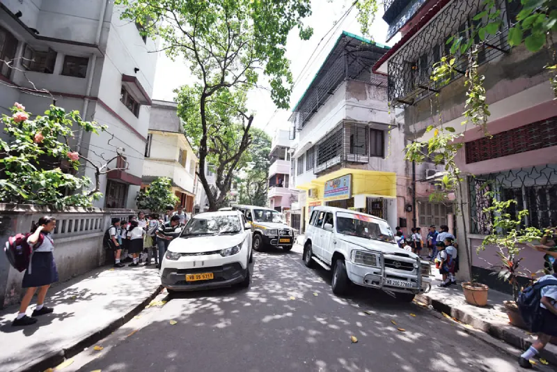 Cars parked on a street in Kolkata