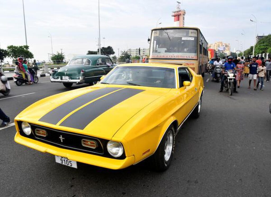 A yellow Maserati drives on Chennai streets