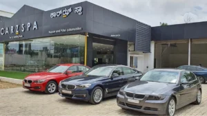 Three luxury cars parked outside a detailing studio in Chennai