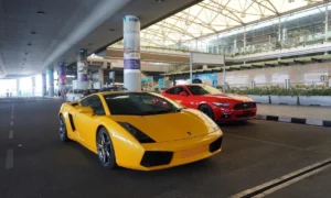 A yellow Lamborghini parked outside the Hyderabad International Airport