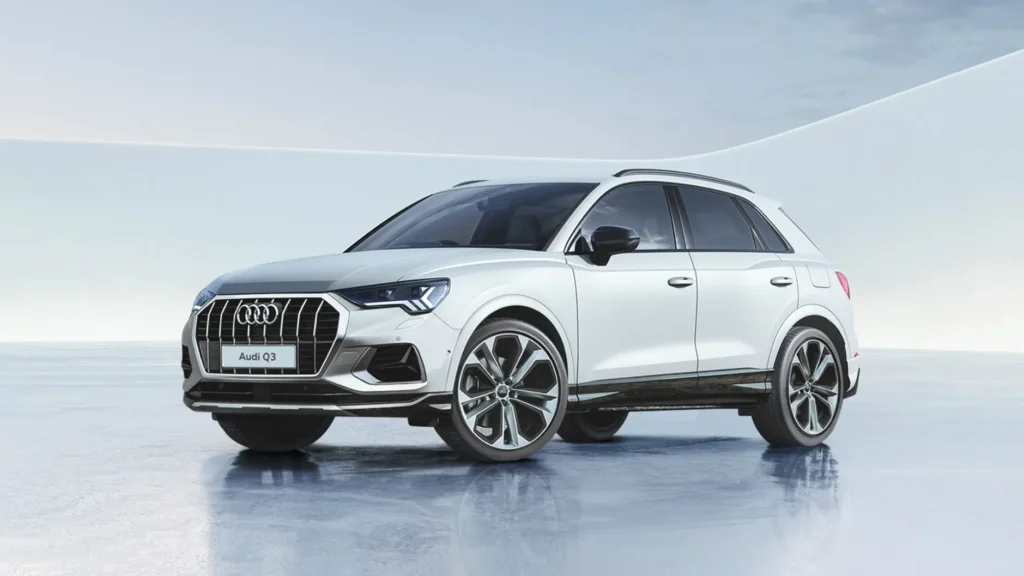 A while-coloured Audi Q3 parked indoors on a white reflective surface