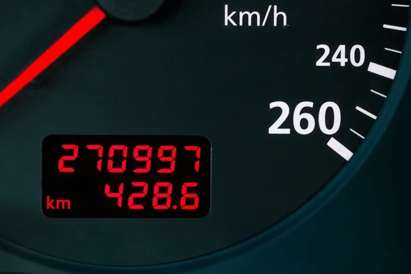 A person calculating mileage