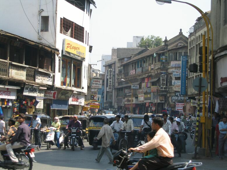 A congested crossroad during the day in Pune, India